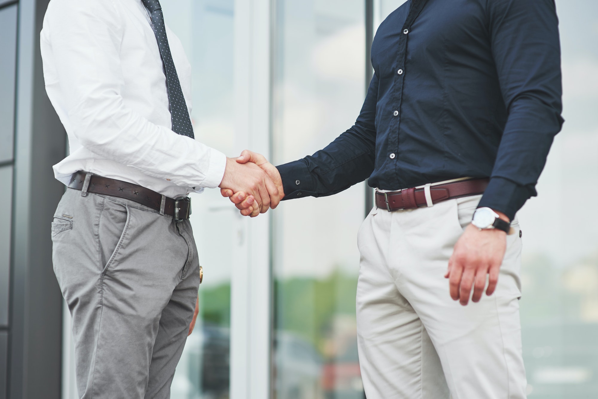 Handshake of two men. Successful business contacts after a good deal